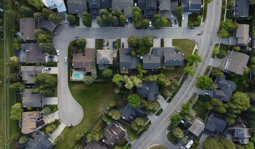 Aerial view of a residential neighborhood of houses and streets
